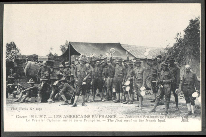 Image for Americans in France 1914-1917 Soldiers raise plates 1st meal postcard 1917