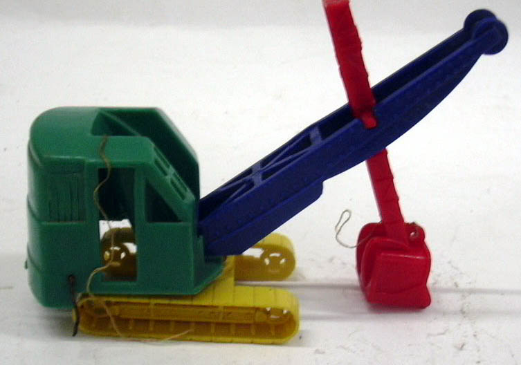 Image for Banner plastic steamshovel needing restringing 3" tall