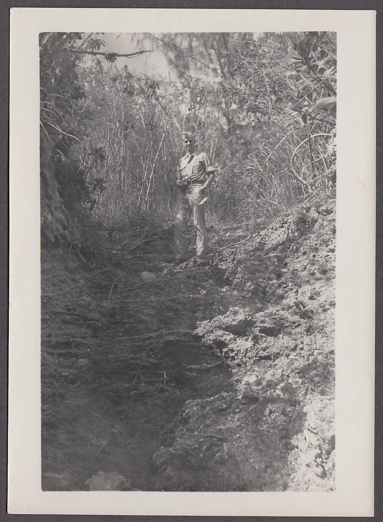 Image for Army Doctor Erikson standing on coral formation Saipan photo 1947