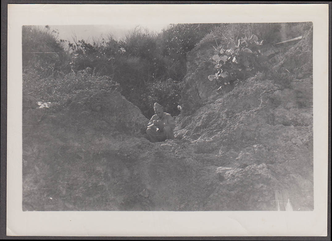 Image for US Army Doctor Erikson examining coral Saipan photo June 1947